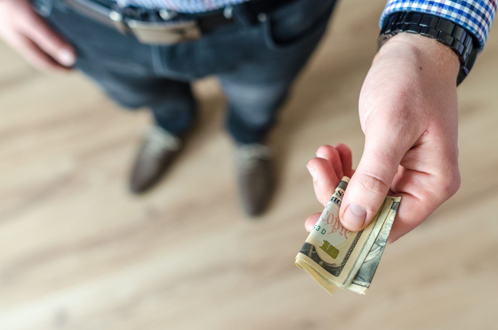 person holding money bills